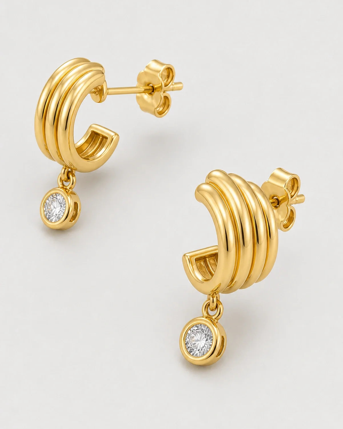 Front, reverse, post and butterfly-back construction view of the Astra earrings