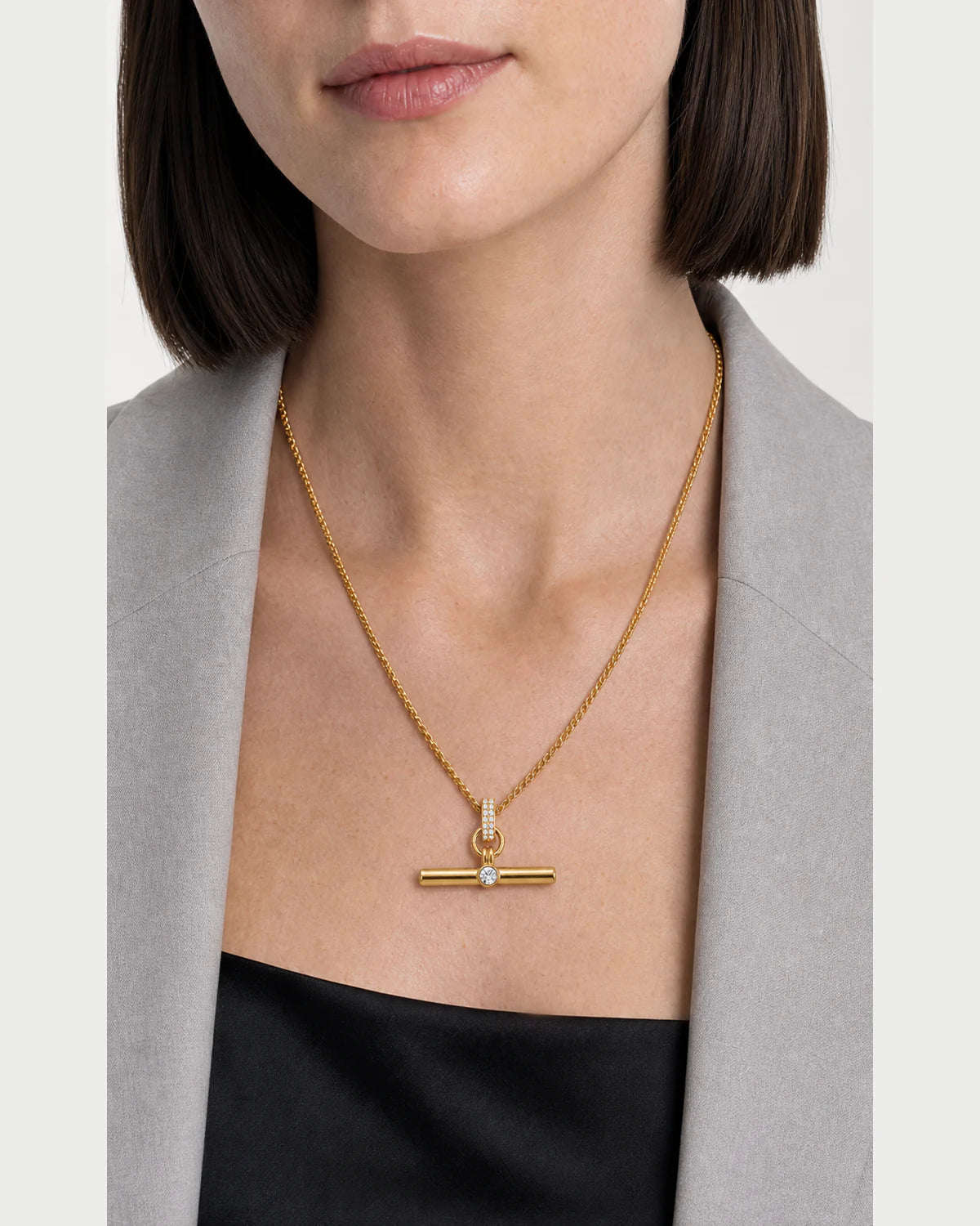 Clean neckline close-up showing the scale and detail of the Delphine necklace