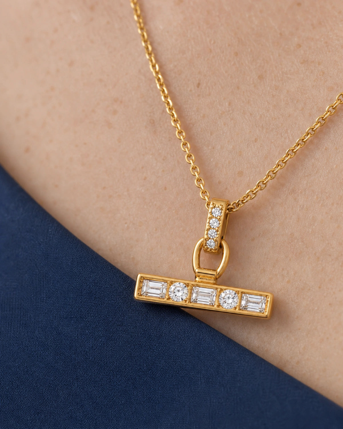 Extreme worn macro of the Vienne four-stone bail and five-stone crystal T-bar on Margot