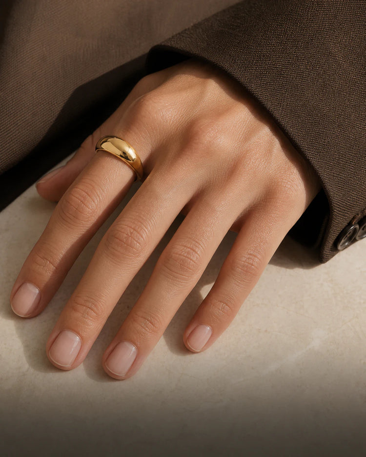 Lune dome ring worn with espresso tailoring