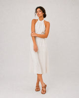 Full-body ivory linen summer portrait featuring the Amara initial bracelet