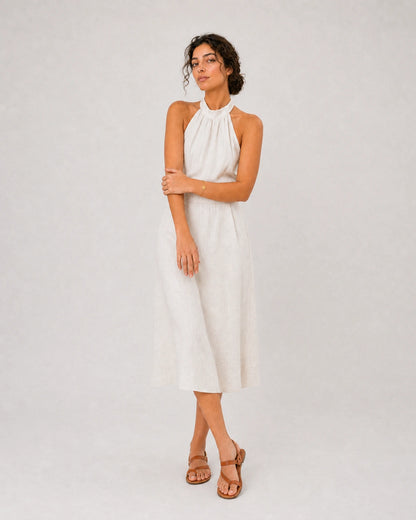 Full-body ivory linen summer portrait featuring the Amara initial bracelet