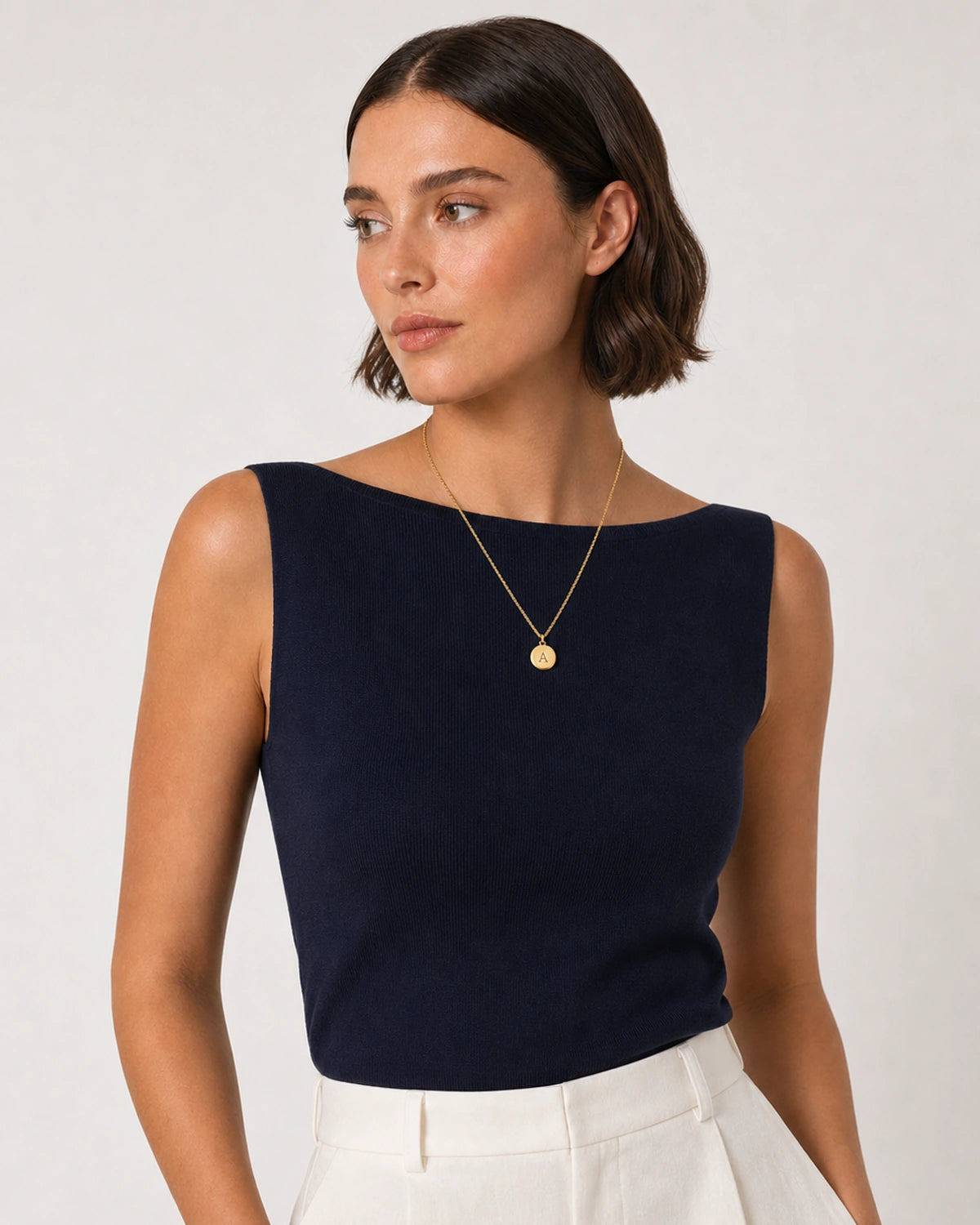 Alternate Riviera portrait featuring the Amara gold initial necklace