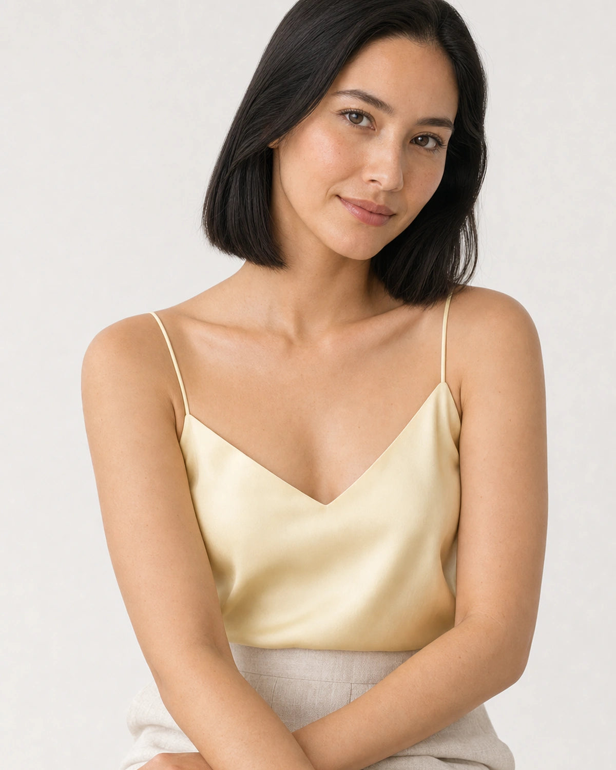 Model in black tailoring wearing the Amaya pavé MAMA bracelet