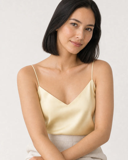 Model in a butter-yellow Capri summer camisole wearing the Amaya pave MAMA bracelet