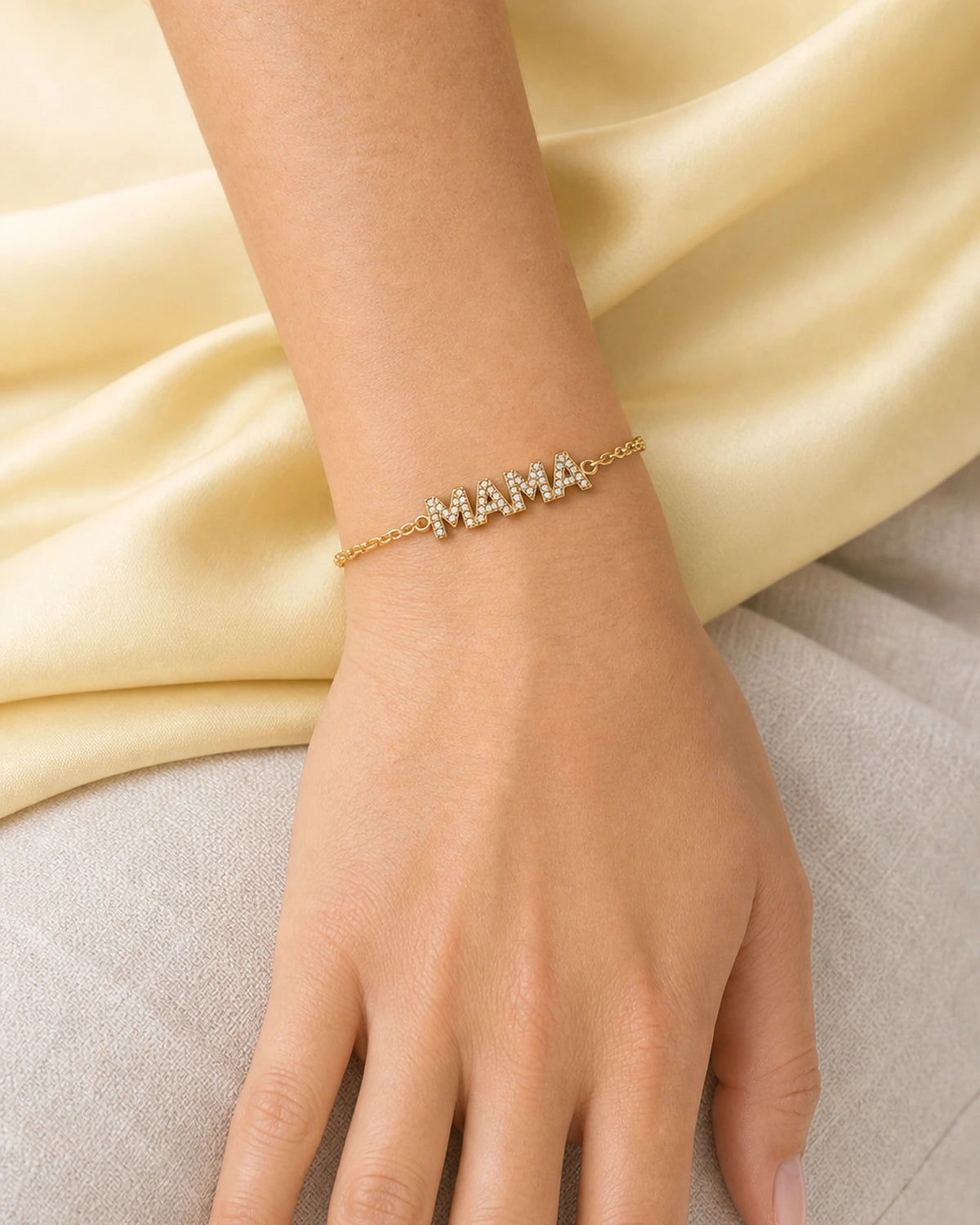 Close wearing view of the Amaya four-letter pave MAMA word-bar