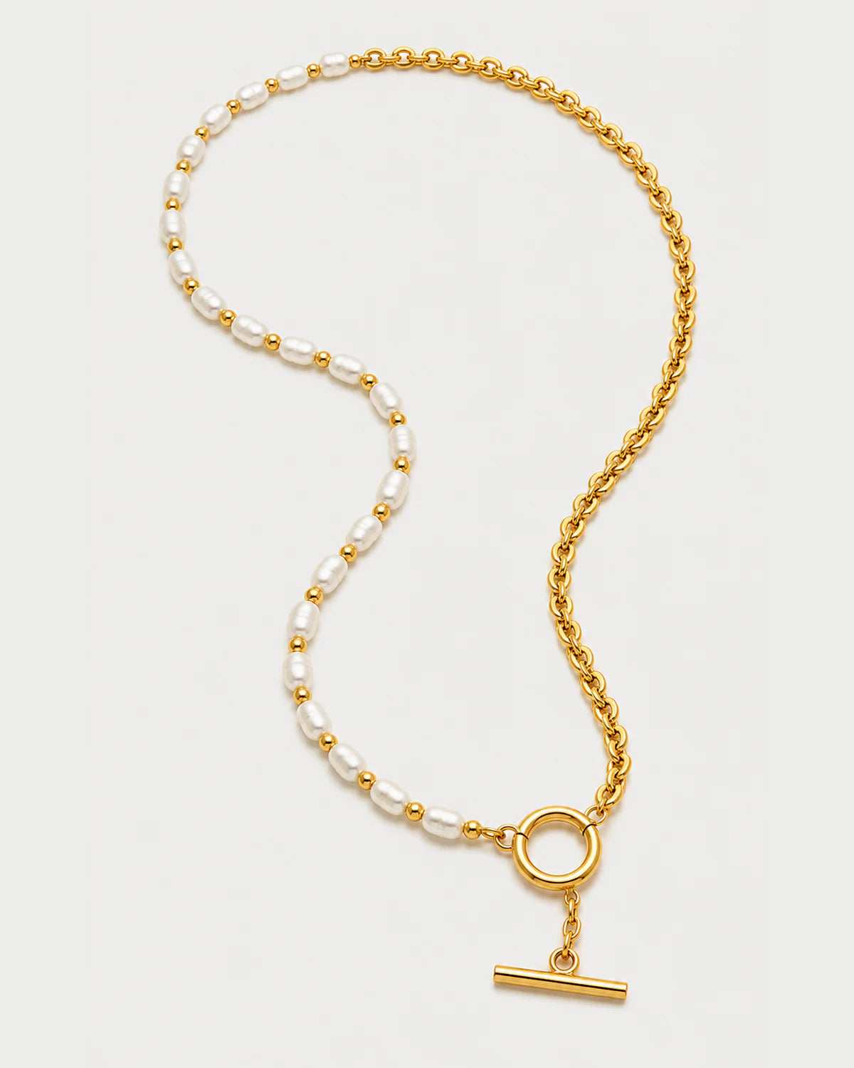 Amélie pearl and chain necklace in an alternate arrangement on pale grey