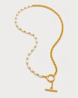 Amélie pearl and chain necklace in an alternate arrangement on pale grey