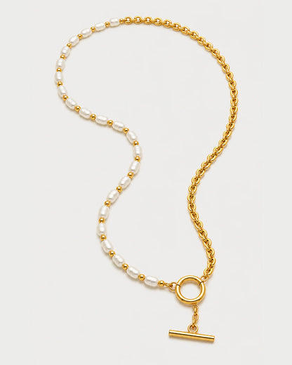 Amélie pearl and chain necklace in an alternate arrangement on pale grey