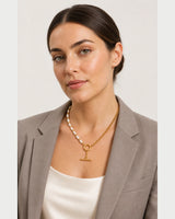 British model wearing the Amélie pearl and chain toggle necklace