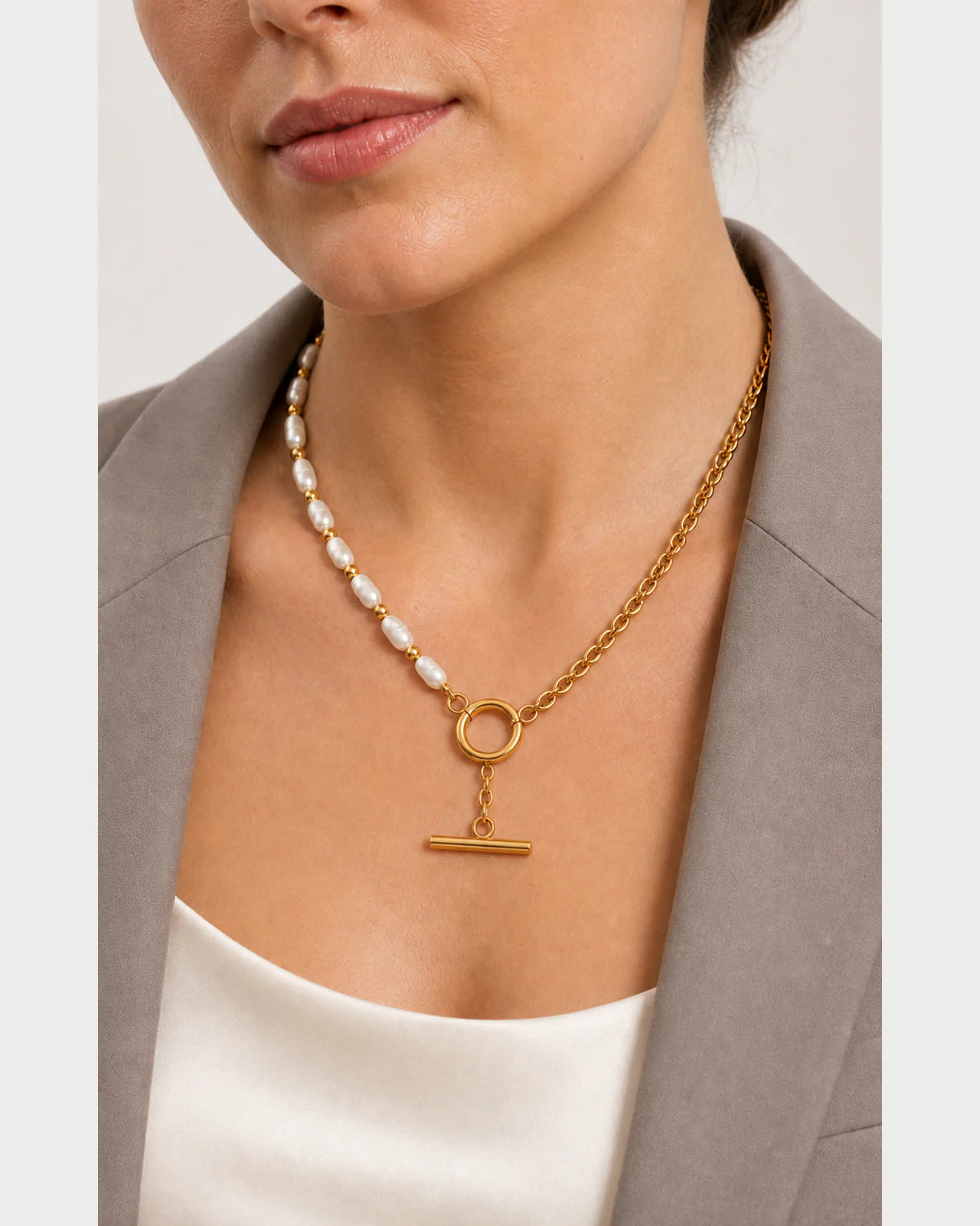 Clean neckline close-up of the asymmetrical Amélie necklace