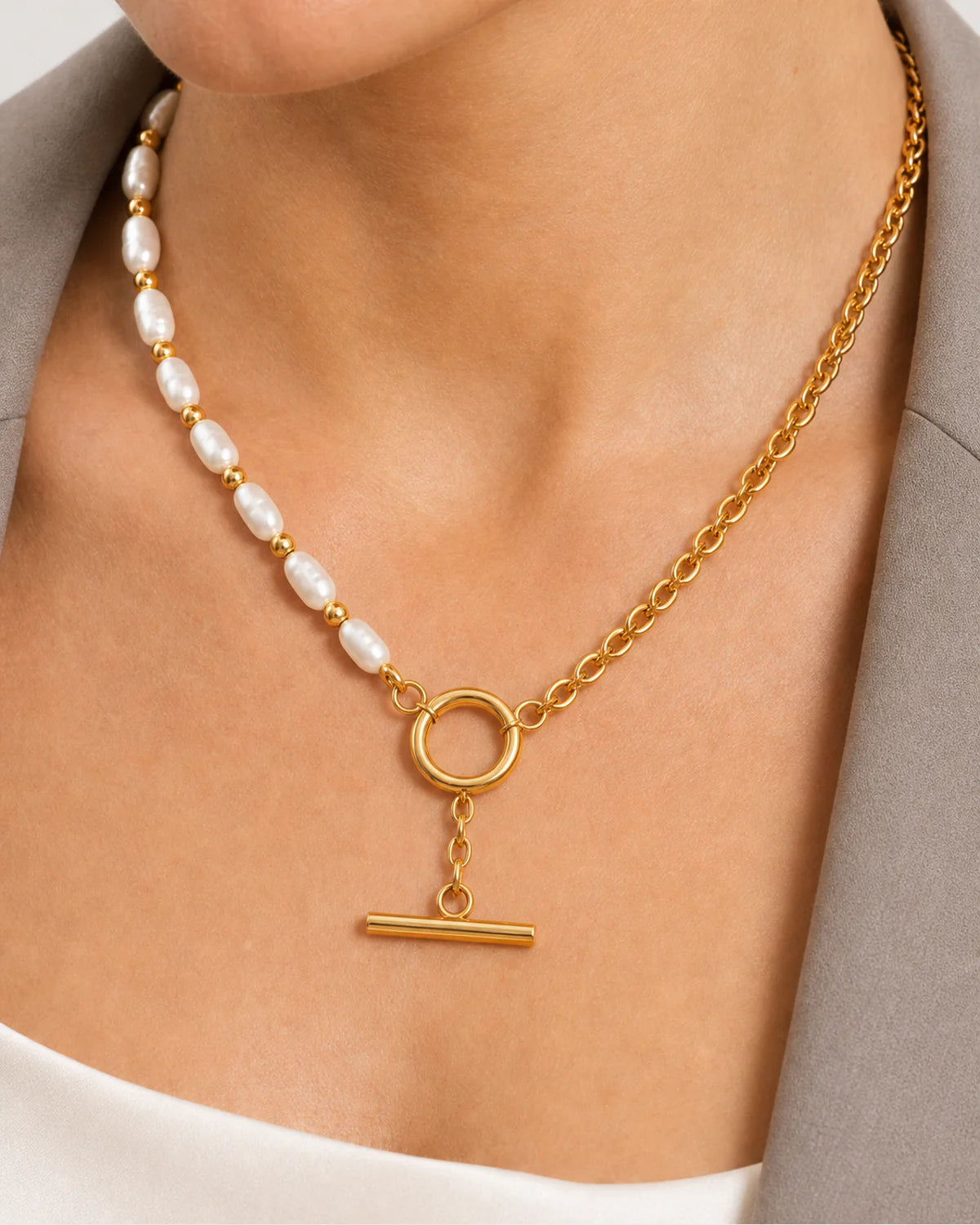 Extreme on-body macro of the Amélie pearl, chain and toggle details