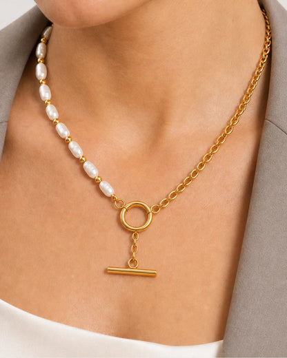 Extreme on-body macro of the Amélie pearl, chain and toggle details