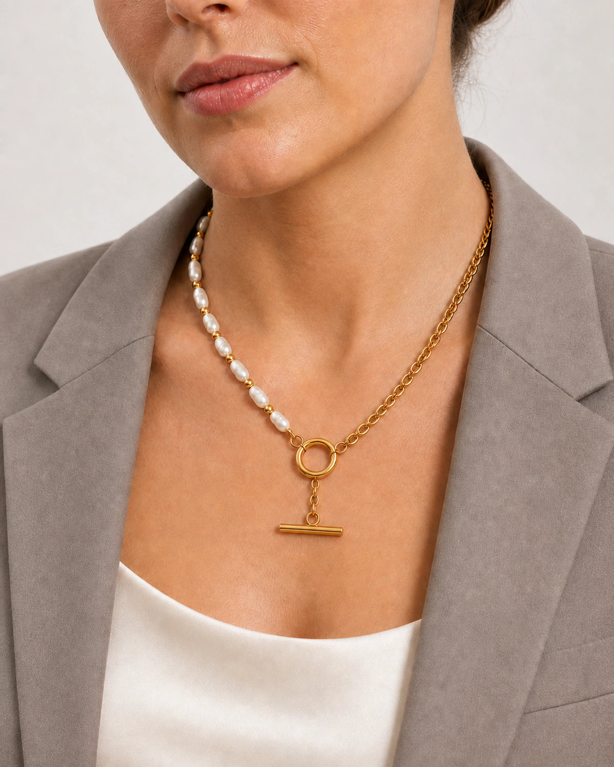 Clean neckline close-up of the asymmetrical Amélie necklace