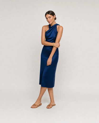 Full-body cobalt silk summer portrait featuring the Amorette bracelet