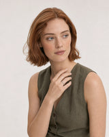 Model in an olive Tuscany linen waistcoat top wearing the Amoura silver open-heart ring