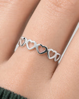 Extreme worn macro of the Amoura silver open-heart construction and polished joins