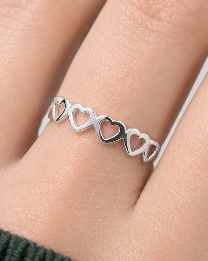 Extreme worn macro of the Amoura silver open-heart construction and polished joins
