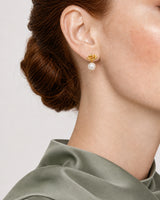 Eye-free right profile of Laurel wearing the gold Apolline earring