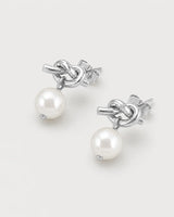 Apolline silver knot pearl earrings in an alternate studio arrangement