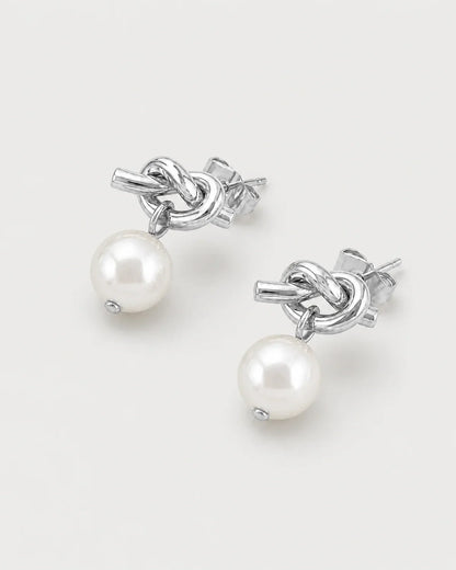Apolline silver knot pearl earrings in an alternate studio arrangement
