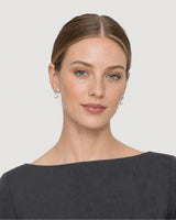 American model wearing the Apolline silver knot pearl earrings