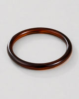 Alternate flat-lay view of the seamless Arden slim espresso bangle