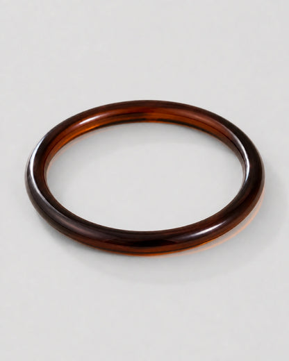 Alternate flat-lay view of the seamless Arden slim espresso bangle