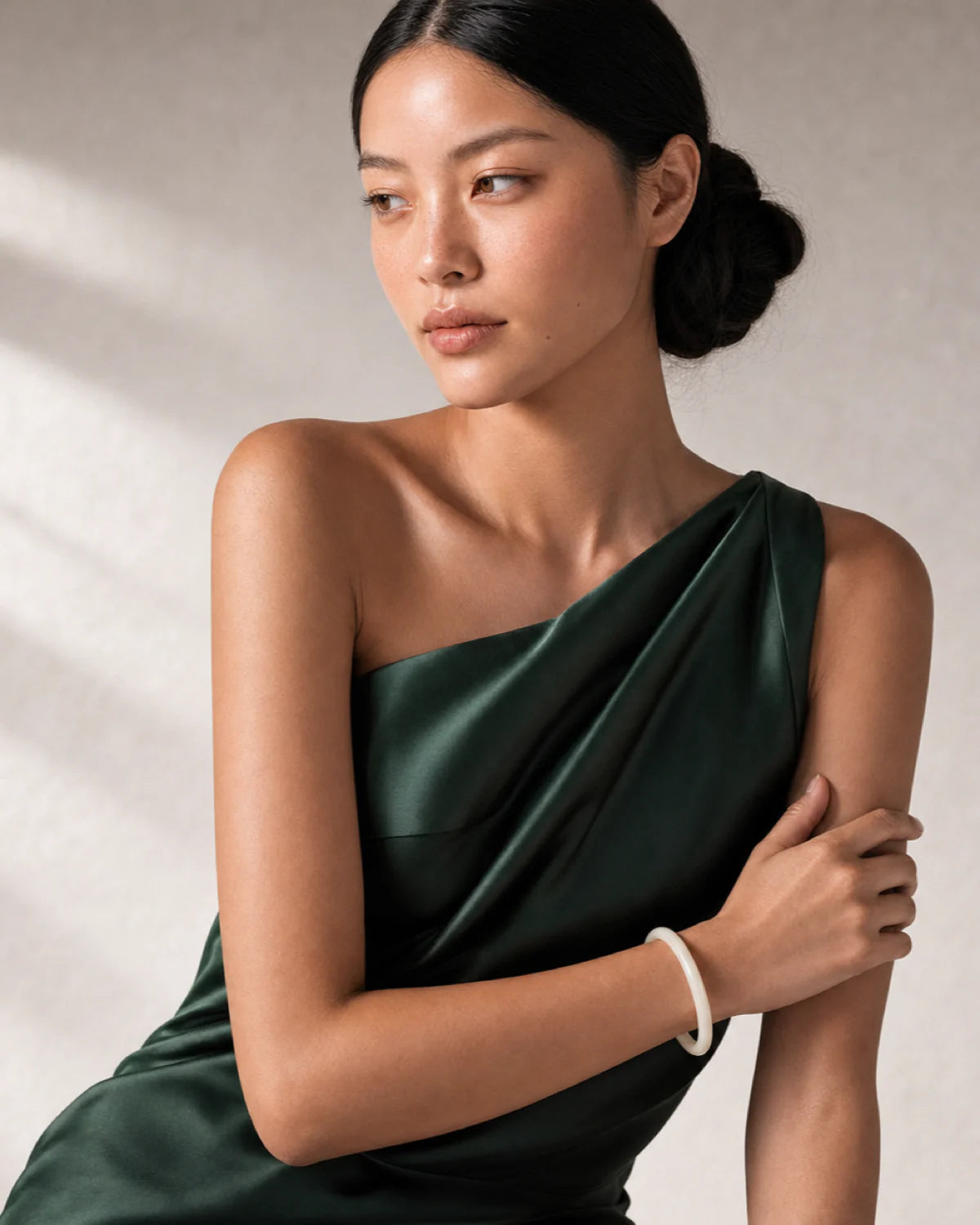 Three-quarter model portrait wearing Arden with a reflective side gaze