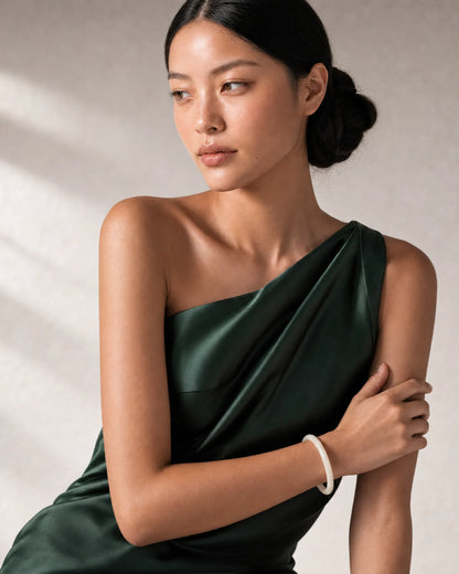 Three-quarter model portrait wearing Arden with a reflective side gaze