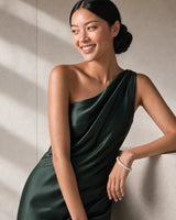Smiling model beside limestone wearing the Arden slim ivory resin bangle