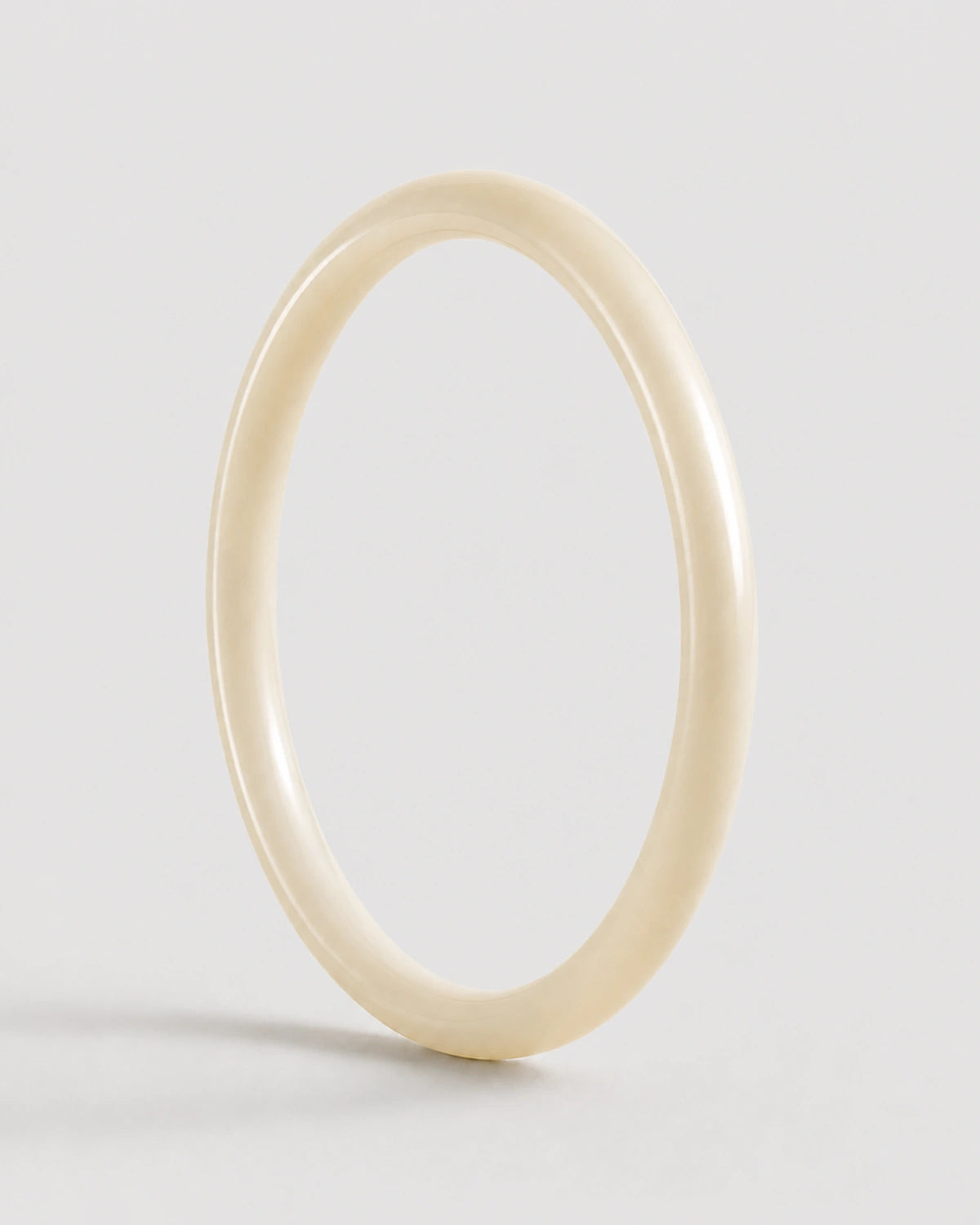 Arden slim ivory resin bangle on warm soft ivory
