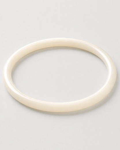 Alternate flat-lay view of the seamless Arden slim ivory bangle