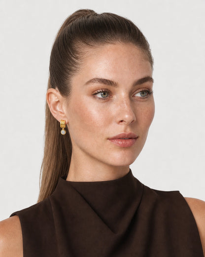 Alternate portrait of the same model wearing the Astra earrings