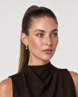 Alternate Positano summer portrait featuring the Astra gold zircon earrings