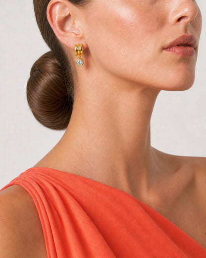 Eye-free side ear and jaw close-up of Freya wearing an Astra triple-arc earring