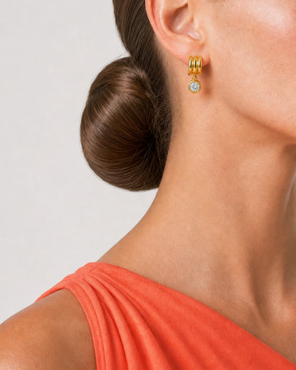 Eye-free rear three-quarter ear and neck crop of Freya wearing an Astra earring