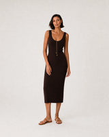 Full-body espresso knit summer portrait featuring the Aurelia droplet lariat
