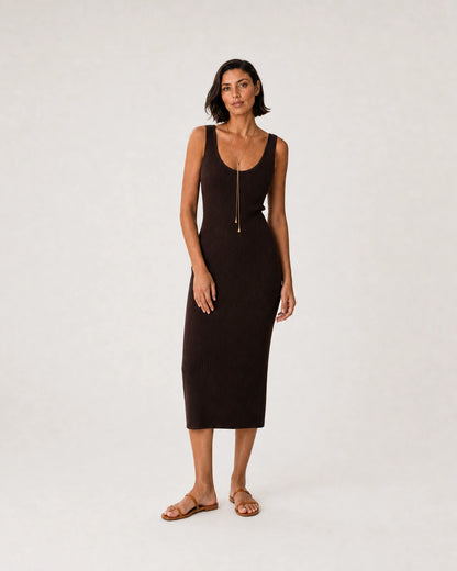 Full-body espresso knit summer portrait featuring the Aurelia droplet lariat
