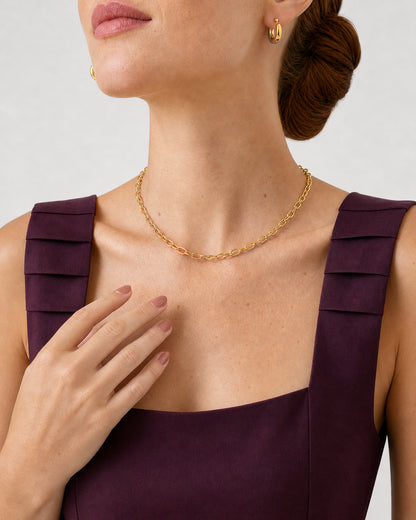 Shoulder-turned wearing detail of the Aurelle gold everyday jewellery set