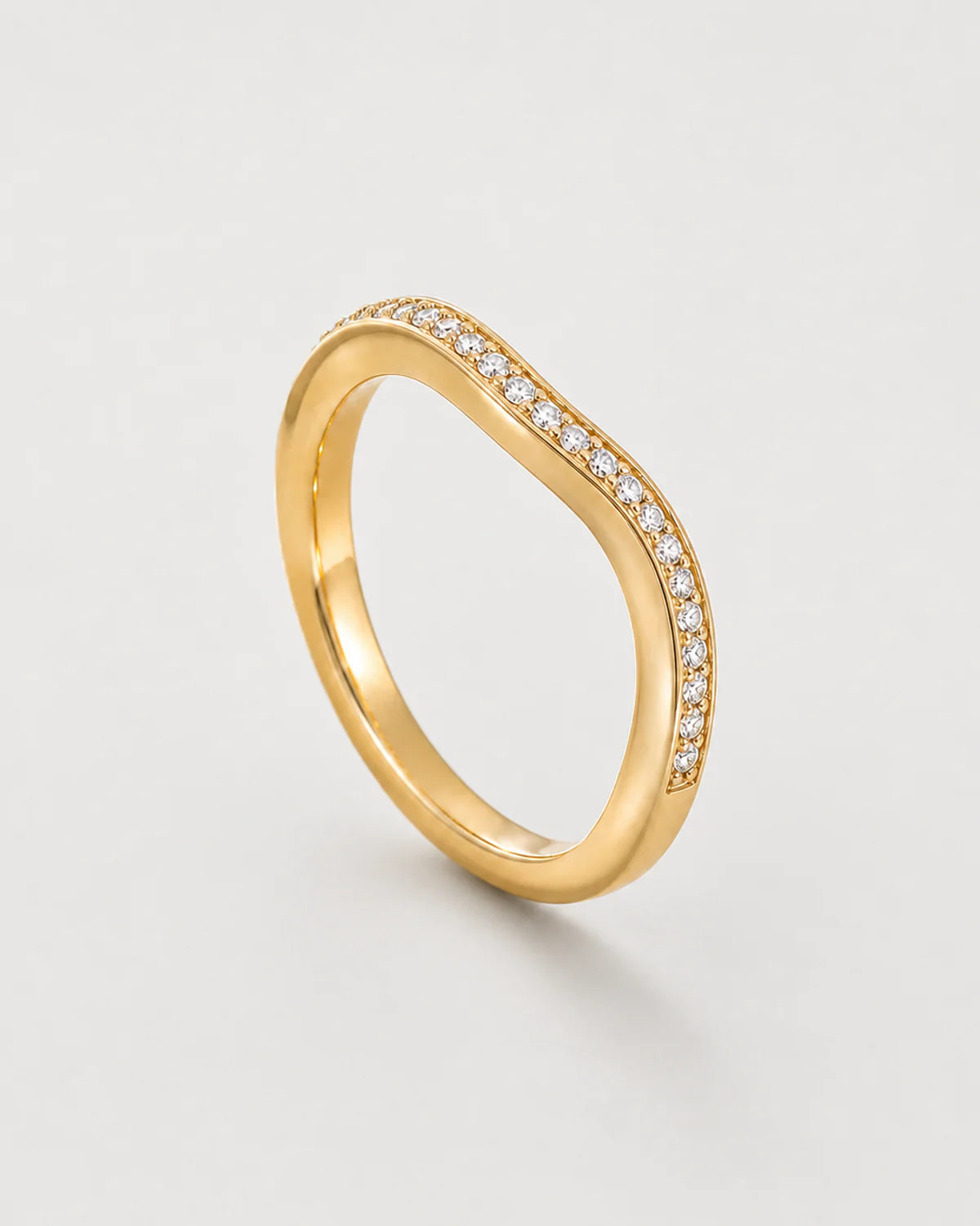 Aurelle gold wavy pavé band on pale dove-grey