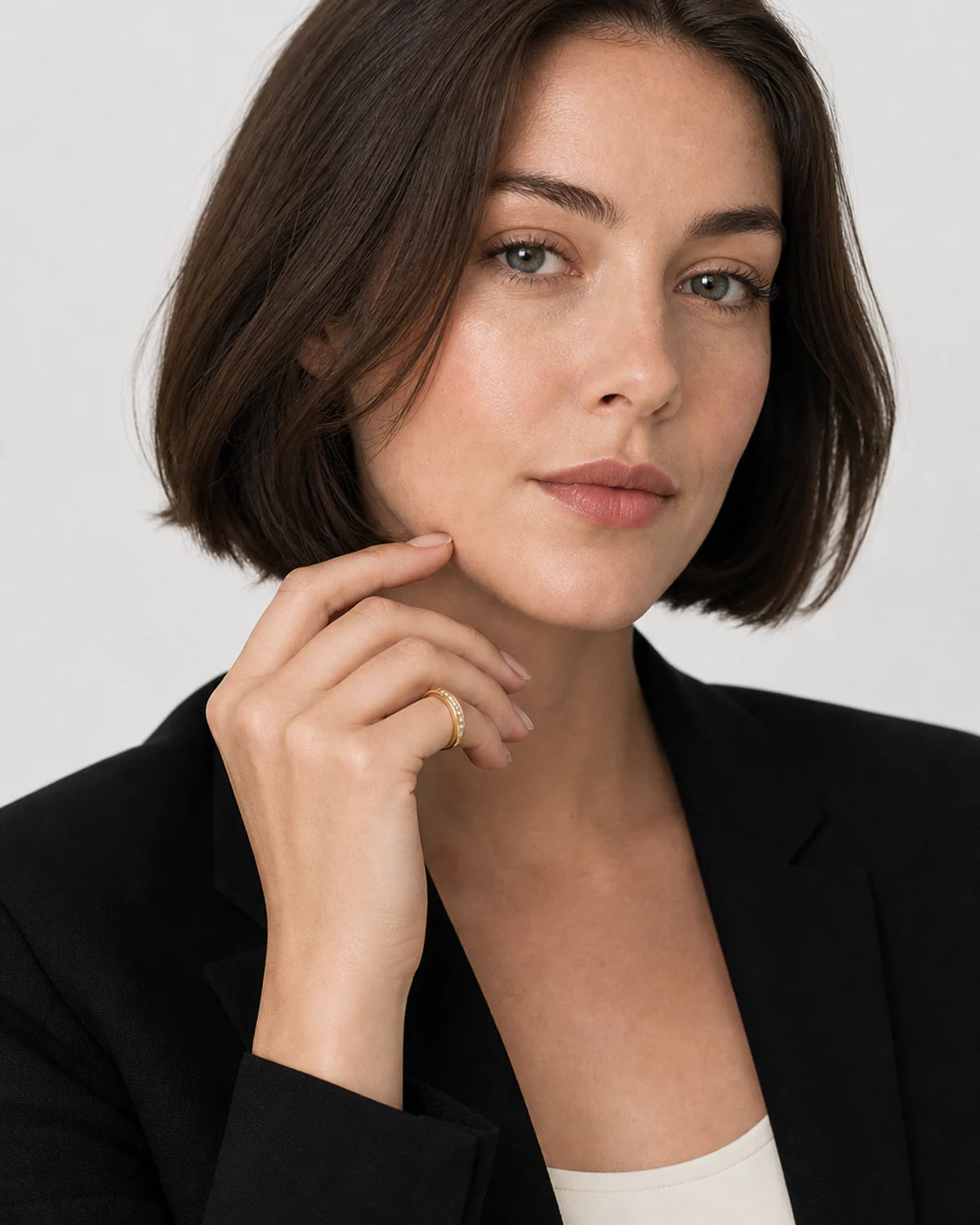 British model in black tailoring wearing the Aurelle pavé band