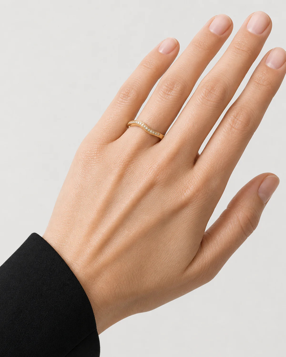 Extreme on-hand detail of the Aurelle single-row pavé band