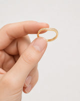 Hand-held scale view of the Aurelle pavé band