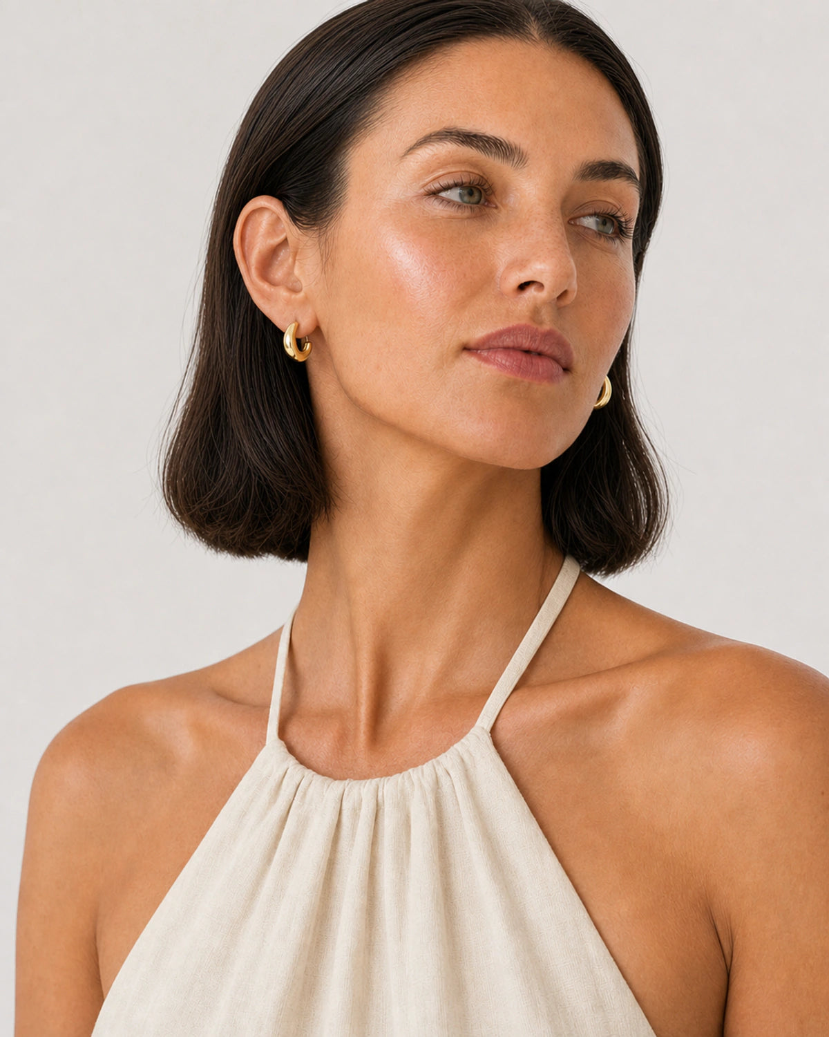Alternate Amalfi summer portrait featuring the Aurelle gold open hoops
