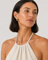 Alternate Amalfi summer portrait featuring the Aurelle gold open hoops