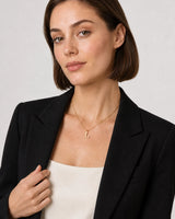 Alternate studio portrait of the same model wearing the Aveline initial necklace