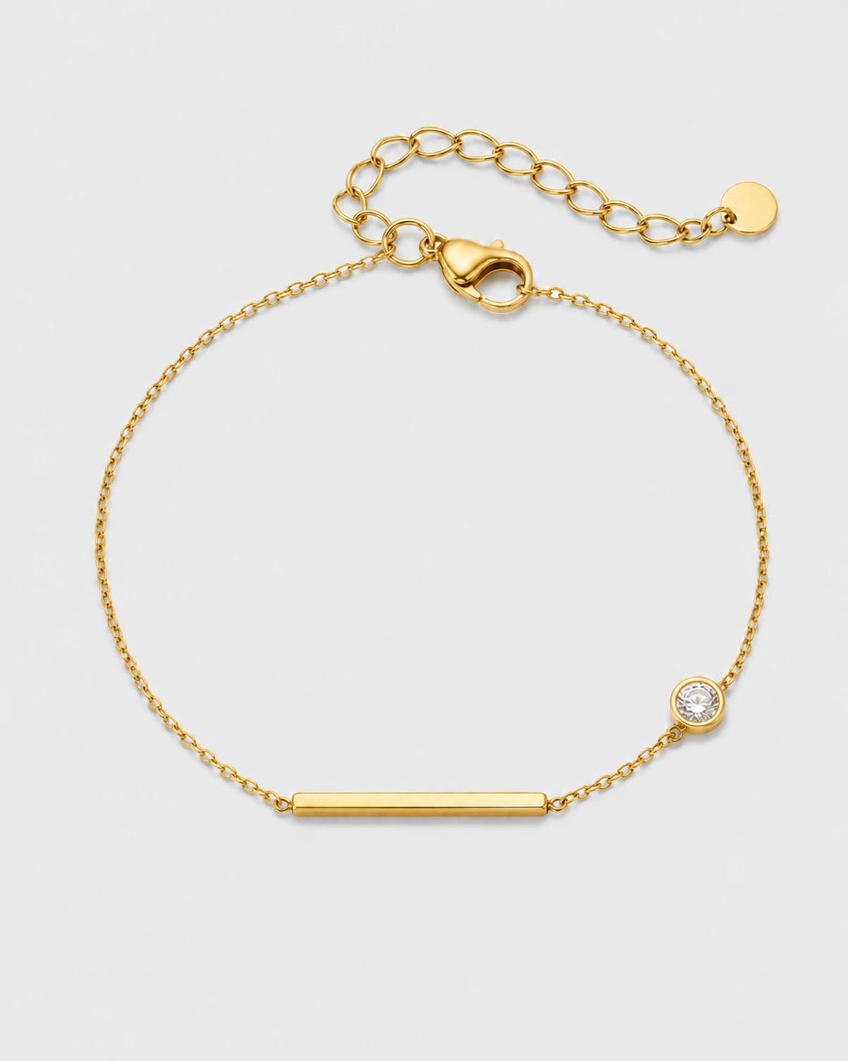 Aven gold bar and zircon station bracelet on warm soft ivory