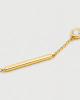 Macro of Aven polished gold bar and offset bezel zircon bracelet