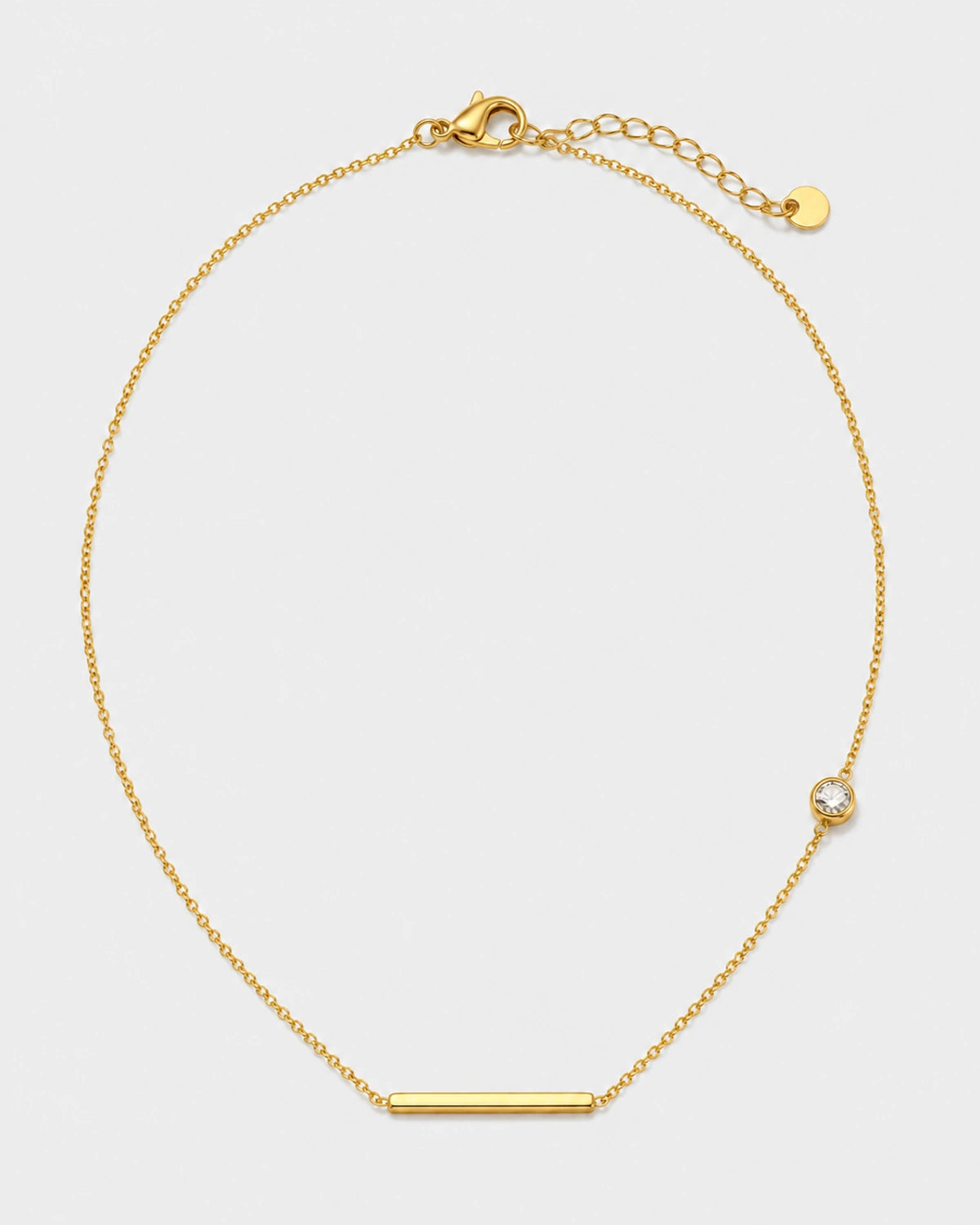 Aven gold bar and zircon station necklace on warm soft ivory